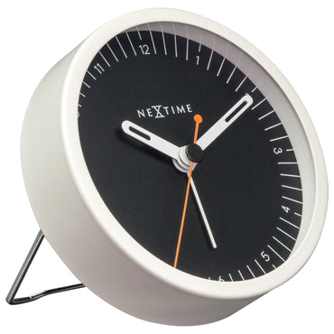 NeXtime small metal table alarm clock with light function, silent operation, 9x9x7.5cm, shown from left side.