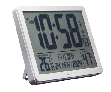 NeXtime alarm clock with digital display, weather station features, and ABS construction, shown from the left side.