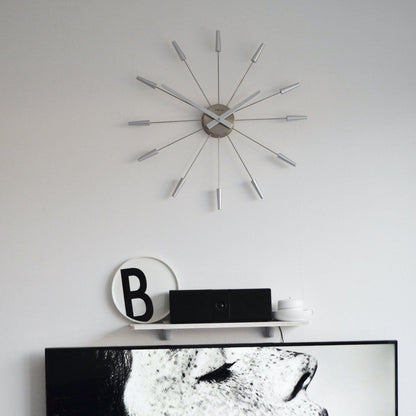 Vintage NeXtime Silent Wall Clock with stainless steel finish, 58cm diameter, classic design, labeled 'Plug Inn'.