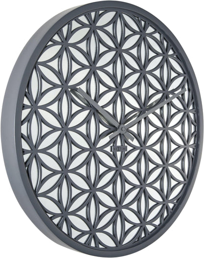 NeXtime Clocks Bella Mirror wall clock with 50cm wooden frame and mirror accents, showing a stylish left side view.