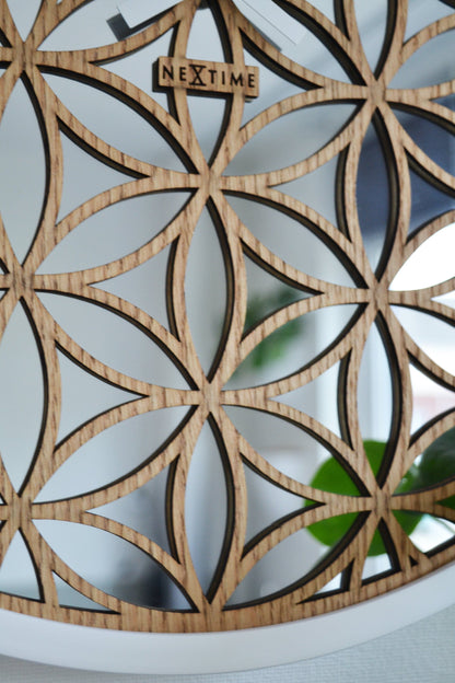 NeXtime Clocks Bella Mirror wall clock with 50cm wooden frame and mirrored accents, modern decorative timepiece.