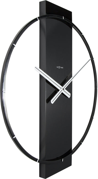 NeXtime wall clock with wood and steel design, showing a left side view of the 50.8 x 58.2 cm clock on a wall.