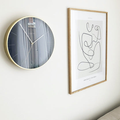 Vintage NeXtime Essential Gold wall clock, 34 cm with glass and metal, featuring a stylish gold finish for interior decor.