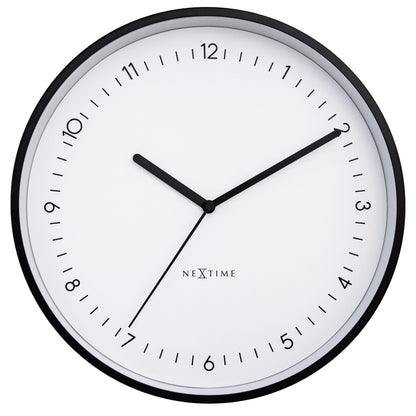 NeXtime Berlin wall clock, 30cm aluminum silent clock with black hands and minimalist design, mounted on a wall.