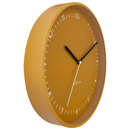 NeXtime Berlin wall clock, 30cm silent aluminium clock with black hands and minimalist design, showing a left-side view.
