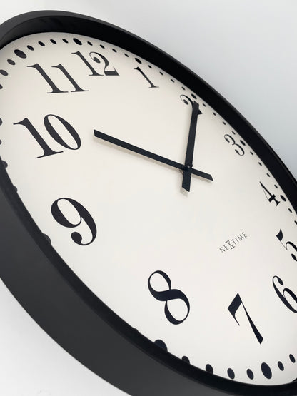 NeXtime Dickens large wall clock, 50cm, silent operation, black and white plastic design, detailed view of clock face.
