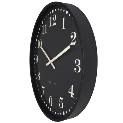 Black and white NeXtime Dickens large 50cm wall clock with a silent mechanism, plastic construction, shown from the right side.