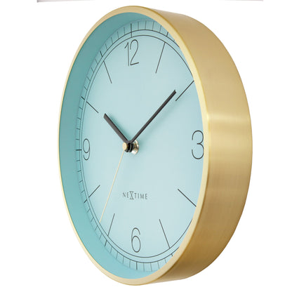 NeXtime Bolero wandklok met turquoise, wit en zwart metalen wijzers, 25 cm diameter, stille werking, rechterzijde foto.