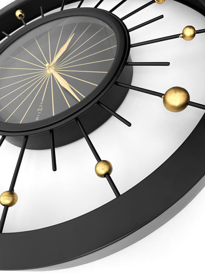 Black metal NeXtime Orbit wall clock, 60cm silent clock with modern design, detailed view of the clock face and hands.