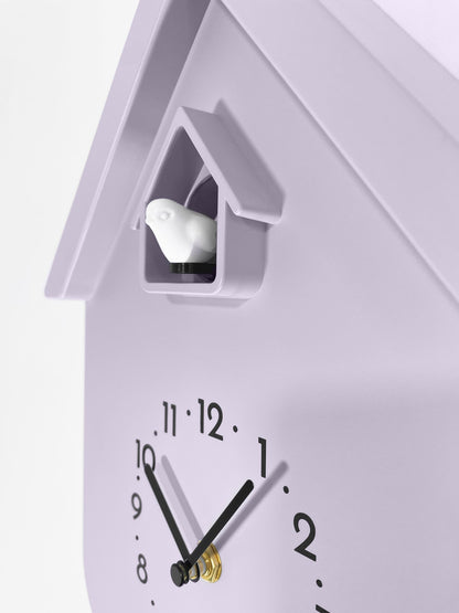 NeXtime Twitter wall clock with pendulum, cuckoo design, measuring 21.5x41.5x8.5cm, detailed view of clock face and pendulum