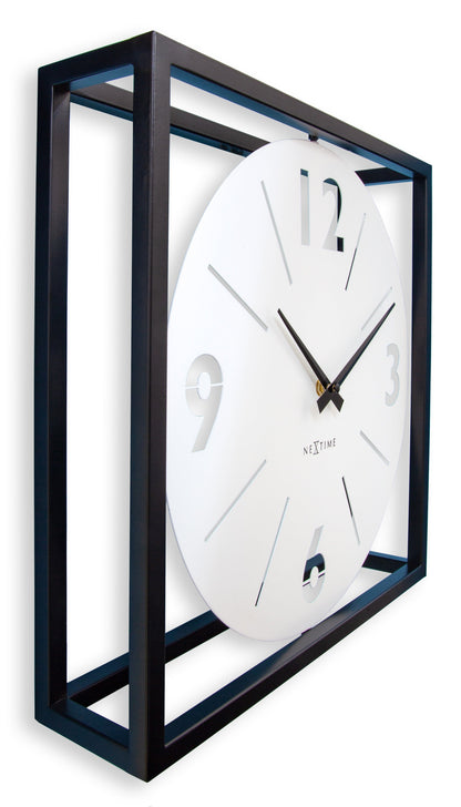 NeXtime black and white metal wall clock, 40x40x9.5 cm, with a modern frame design, showing the clock face with minimalist style