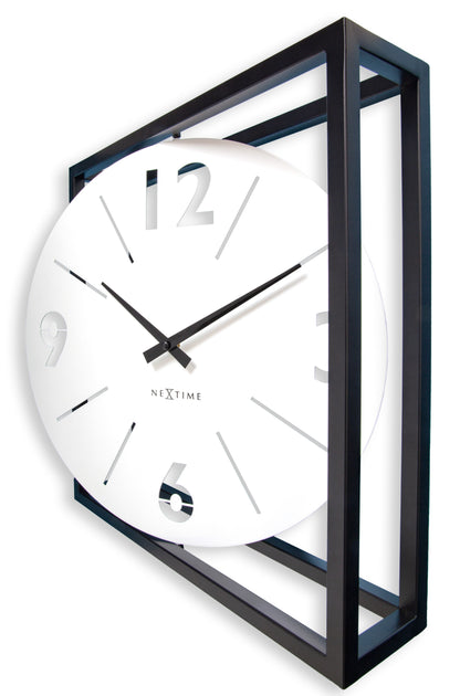 Black and white NeXtime wall clock with a metal frame, measuring 40x40x9.5 cm, showing the clock face and right side.