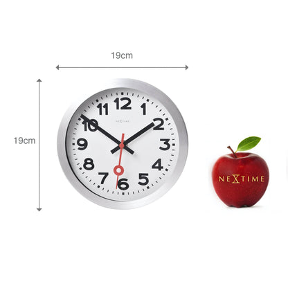 NeXtime Clocks aluminum station numbers wall or table clock showing a modern analog design with bold number markers.