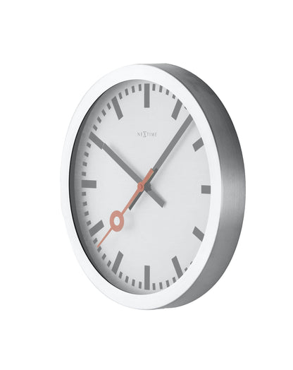NeXtime Station Stripe aluminum wall or table clock with a modern striped design, shown from the right side.