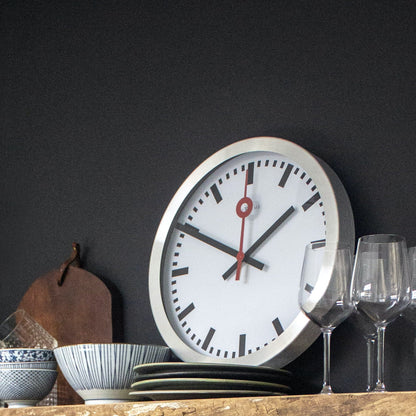 NeXtime Clocks Station Stripe aluminum table or wall clock with modern striped design and minimalist style.