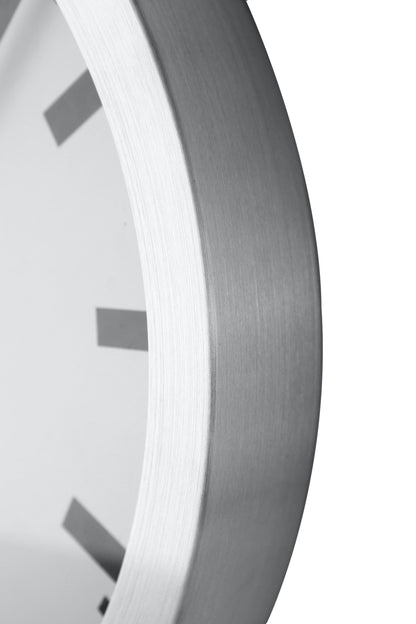 NeXtime Clocks Station Stripe aluminum wall or table clock showing a close-up detail of the striped design and sleek finish.