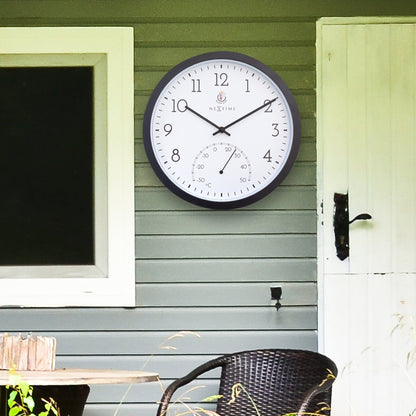 NeXtime Garden Clock with thermometer, weatherproof outdoor clock in Marigold color, 30.5 cm diameter, suitable for outdoor gardens.