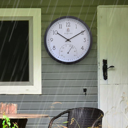 Weatherproof outdoor garden clock with thermometer in marigold color, 30.5 cm diameter by NeXtime Clocks.