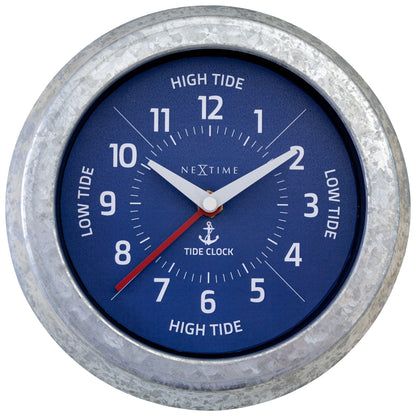 NeXtime Tide wall clock with galvanized silver finish, 22cm diameter, displaying tide status and time.