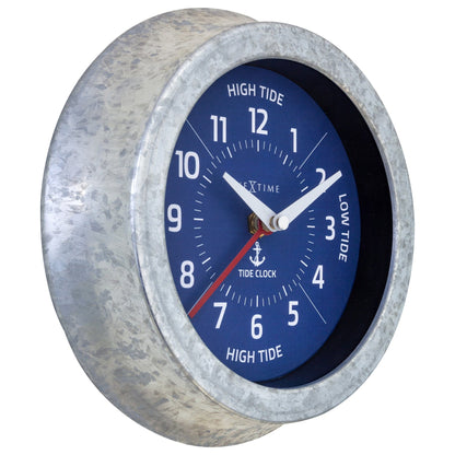 NeXtime Tide wall clock with galvanized silver finish showing tide status, 22cm diameter, clock face with tide indicator.