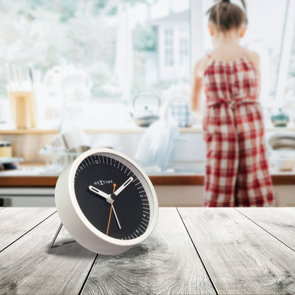 Small NeXtime metal table alarm clock with silent operation and light function, measuring 9x9x7.5cm.