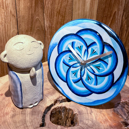 Blue NeXtime Cosmo Table clock with 20cm tempered glass face, silent operation, designed for wall or table display.
