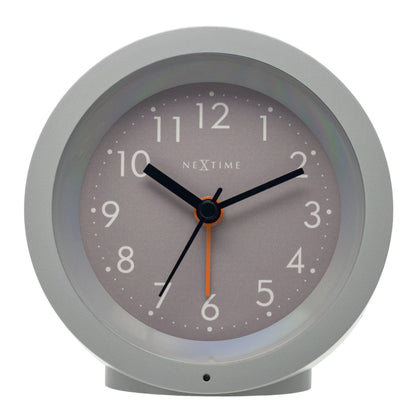 NeXtime Circle alarm clock with silent light dial, 10.5cm diameter, modern design, displayed front view.