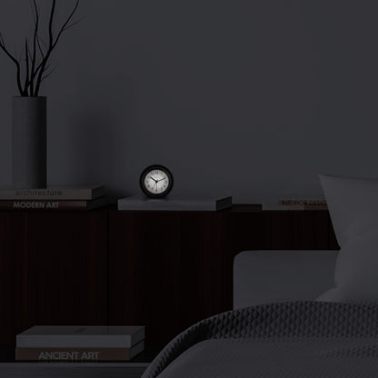 NeXtime Circle alarm clock with silent light dial, 10.5cm x 3.6cm, modern design, suitable for tabletop use.