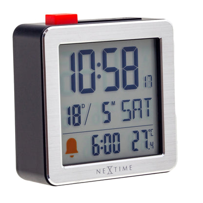 NeXtime Clocks mini digital table alarm clock, metal and ABS, showing time display on a compact 6x6.4x2.1cm device from the left side.