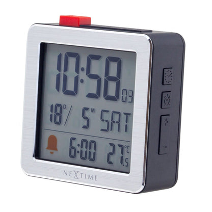 Mini digital table alarm clock by NeXtime Clocks, showing time display on a compact metal and ABS design from the right side.