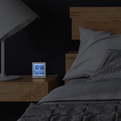 NeXtime digital alarm clock with LED display, compact size 7.7x8.9x3cm, black plastic body, "Wake Up" label on the front.