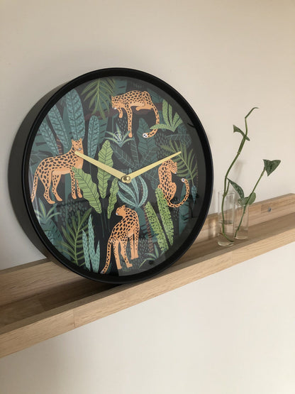 NeXtime Clocks urban jungle 30cm plastic wall clock with bold design and jungle-themed pattern.