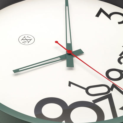 NeXtime Clocks 30cm silent plastic wall clock with dropped number design, modern style and clear clock face.