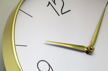 NeXtime Finesse wall clock with 30.5cm gold, chrome, and grey plastic design, silent operation and modern style.