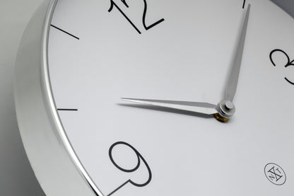NeXtime Clocks Finesse wall clock, 30.5cm, with gold, chrome, and grey plastic finish, silent movement, detailed close-up image.