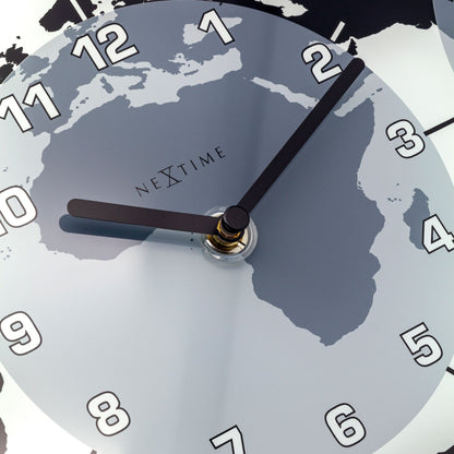 NeXtime Clocks Mondial wall clock with glass face, 50x18.6x3.6 cm, featuring world time display.