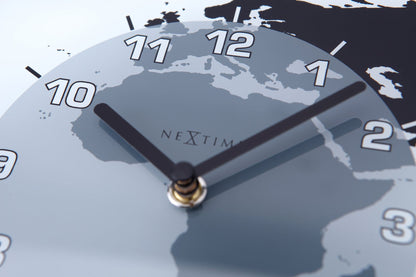 NeXtime Clocks 'Mondial' wall clock with glass face, 50x18.6x3.6 cm, showcasing world time zones and modern design.