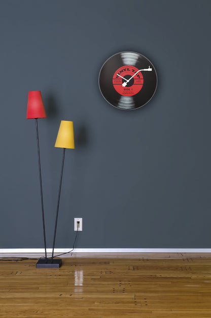 NeXtime Clocks vinyl-themed wall clock, 43 cm diameter, glass face with colorful record design, suitable for modern interiors