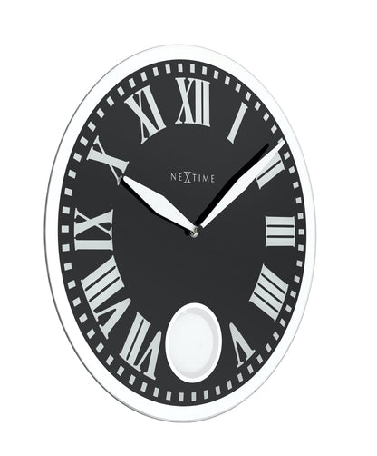 NeXtime Clocks Romana wall clock with glass face, 43x4.2 cm, showing a close-up of the clock's left side and elegant design.