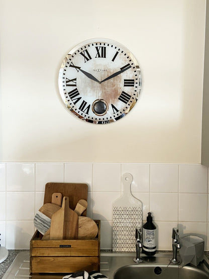 NeXtime Clocks Romana wall clock with glass face, 43x4.2 cm, featuring elegant Roman numeral design.