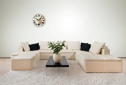 NeXtime Clocks Romana wall clock with glass face, 43 cm diameter and 4.2 cm depth, showcasing a stylish interior design.
