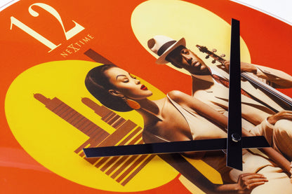 NeXtime Clocks 43cm silent wall clock with multicolor glass design and jazz-inspired style.