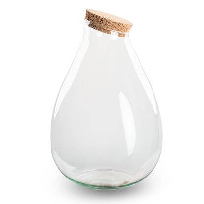 Glass terrarium bottle with cork lid, featuring a DIY floral arrangement, by Florazo NL.