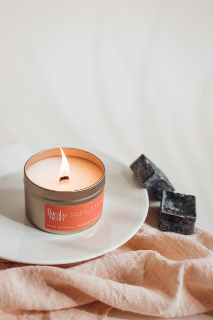 Flambé Fleuri 1001 Nights Candle in decorative tin with intricate floral design, creating a warm and inviting ambiance.